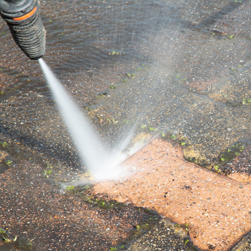 Pressure washing driveway by Ploude Exterior Cleaning in East Kilbride